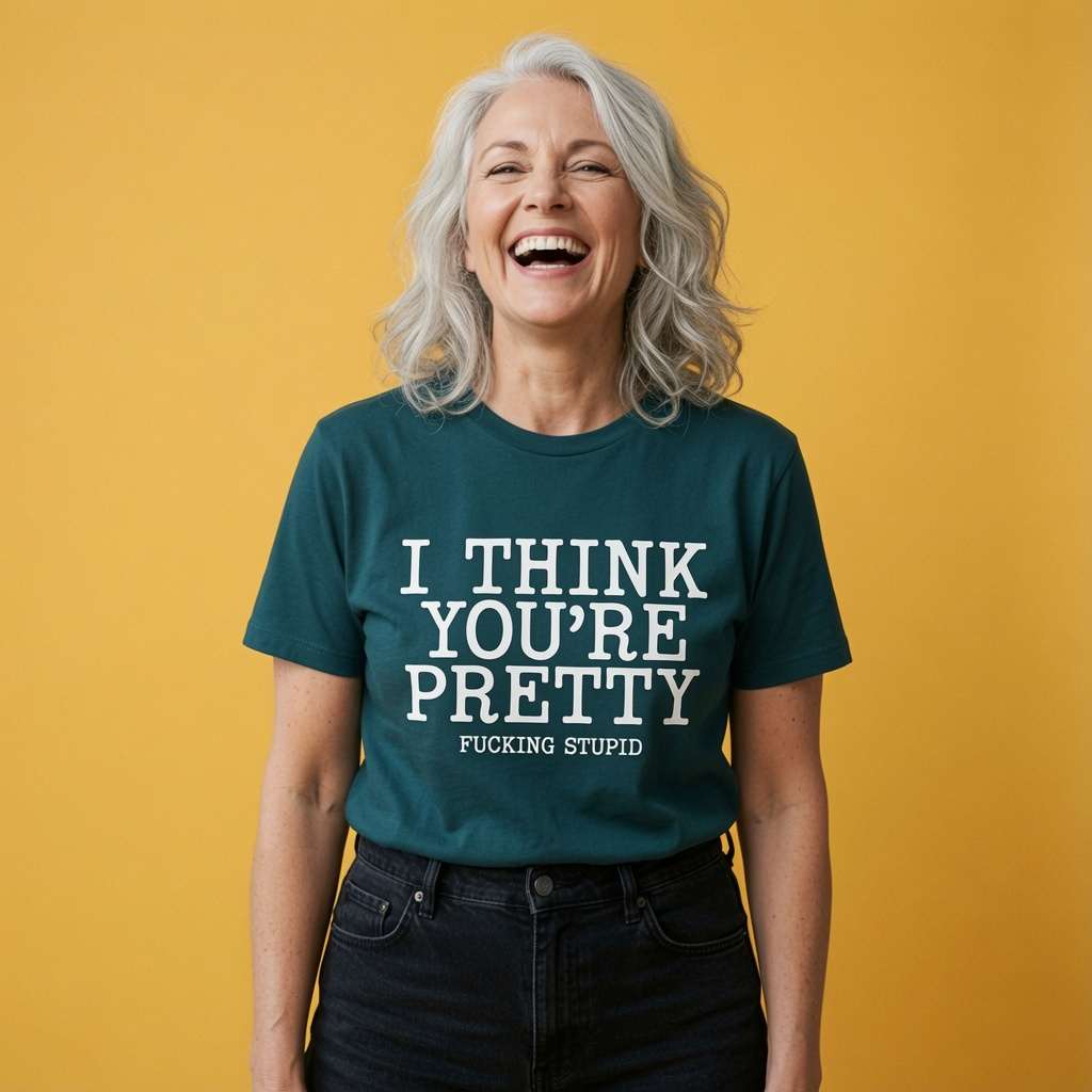 Woman laughing while wearing a green I Think You’re Pretty Fucking Stupid t-shirt, funny ladies rude slogan design full of pure attitude