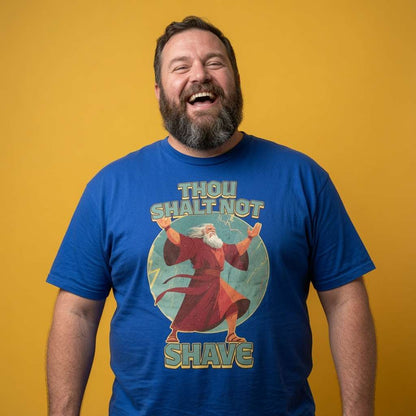 Man laughing while wearing a blue Thou Shalt Not Shave t-shirt, funny mens witty beard graphic design that every cheeky lad will claim