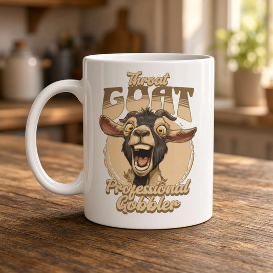 A white ceramic mug on a rustic wooden kitchen counter features a wide-eyed, open-mouthed goat and the humorous text “Throat Goat Professional Gobbler.”