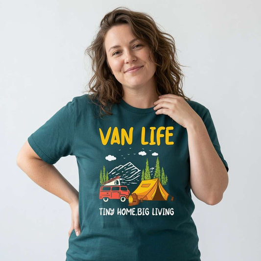 Woman with one hand on her shoulder in a green Van Life Tiny Home Big Living t-shirt, fun and simple camping van tent design that every no-nonsense lady will claim