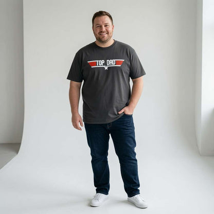 Man smiling with one hand in his pocket while wearing a black Top Dad t-shirt, fun witty and cool dad design full of pure attitude