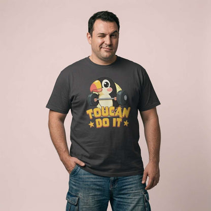 Man winking with one hand in his pocket while wearing a black Toucan Do It t-shirt, funny mens bird pun shirt full of pure attitude