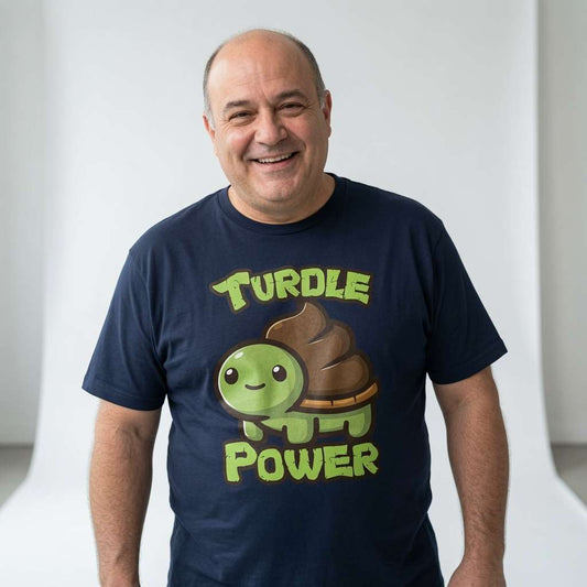 Bald man smiling while wearing a navy Turdle Power t-shirt, cute and funny mens kawaii turtle shirt full of pure attitude