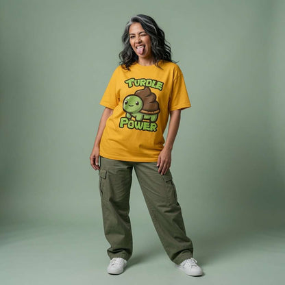 Woman sticking her tongue out while wearing a yellow Turdle Power t-shirt featuring a cartoon turtle with a poop shell, ladies cute kawaii turtle design