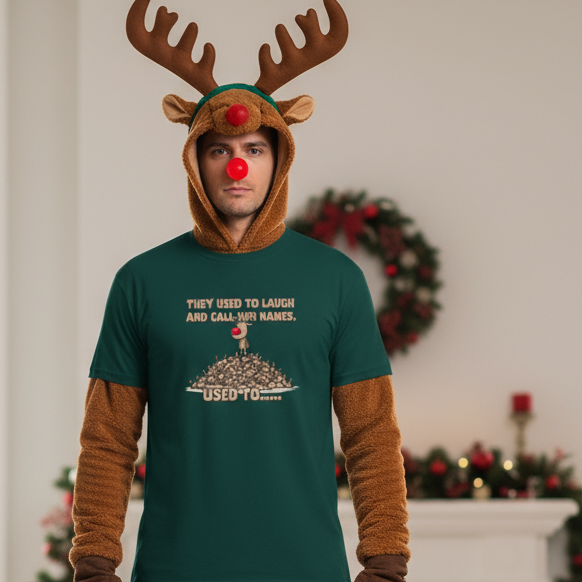 Person wearing a reindeer costume with a green funny Christmas t-shirt and Christmas decorations in the background