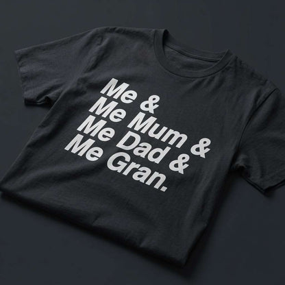 Black Me & Me Mum & Me Dad & Me Gran t-shirt laid flat showing the full white text slogan, fun and cheeky England football design full of pure attitude