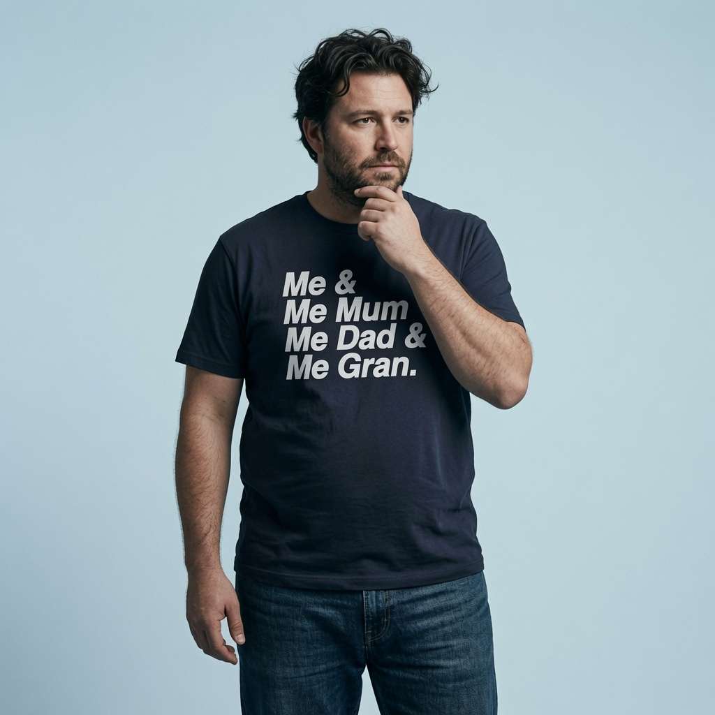 Man with one hand on his chin while wearing a navy Me & Me Mum & Me Dad & Me Gran t-shirt, funny England football-inspired slogan design