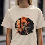 Music T-shirt featuring an illustrated drummer in profile surrounded by splashes of orange. Text reads 