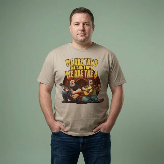 Man standing with both hands in his pockets while wearing a stone We Are The D t-shirt featuring Jack Black and Kyle Gass parody graphic, mens music-inspired design