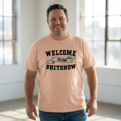 Man smiling with arms by his sides in a peach Welcome to the Shitshow t-shirt, witty pub banter slogan design full of pure attitude