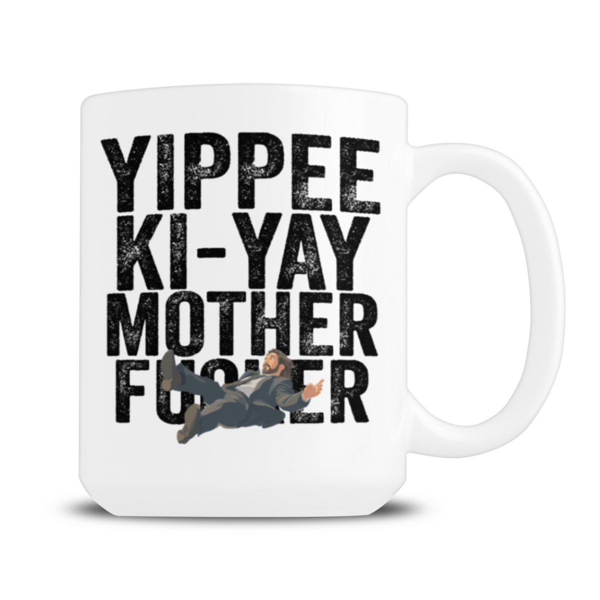 A white ceramic mug with bold black text reading “Yippee Ki-Yay Mother F—er” and a small illustrated man sprawled across the lettering, giving it a cheeky, irreverent tone.