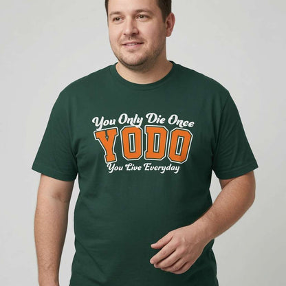 Man smiling slightly with one hand near his waist in a green YODO t-shirt, cheeky mens positive motivational quote shirt that every cheeky lad will claim