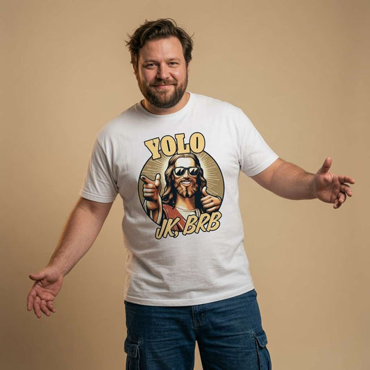 Man standing with both arms outstretched while wearing a white YOLO JK, BRB t-shirt featuring a cool Jesus in sunglasses giving a thumbs-up, offensive funny Jesus Easter joke shirt