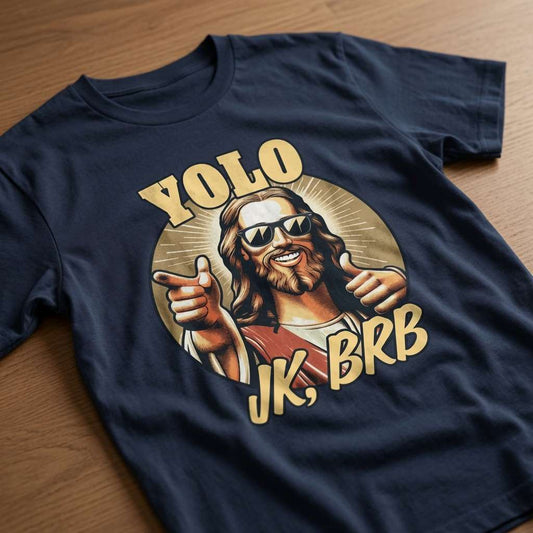 Navy YOLO JK, BRB t-shirt laid flat on a wooden surface showing the full cool Jesus graphic, funny offensive ladies jesus joke easter design full of pure attitude
