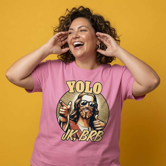Woman laughing with both hands near her face while wearing a pink YOLO JK, BRB t-shirt, rude offensive ladies fun easter jesus design that every no-nonsense lady will claim