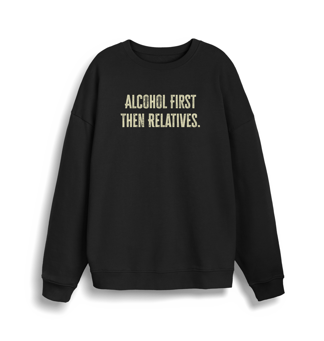 black christmas sweater with the slogan 'alcohol first then relatives'