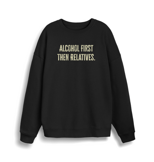 black christmas sweater with the slogan 'alcohol first then relatives'
