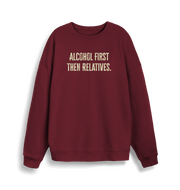 burgundy christmas sweater with the slogan 'alcohol first then relatives'
