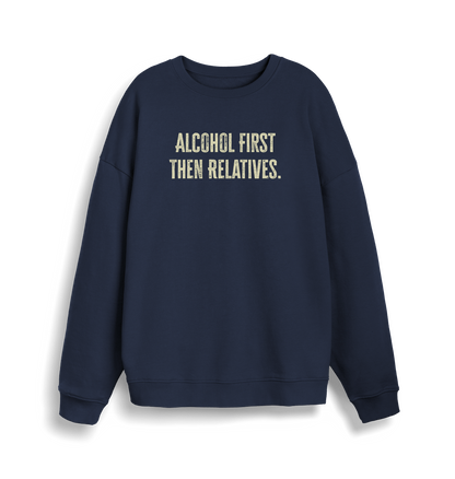 navy christmas sweater with the slogan 'alcohol first then relatives'