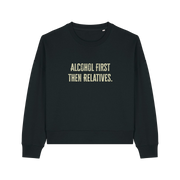 black womens christmas jumper with the slogan 'alcohol first then relatives'