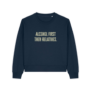 navy womens christmas jumper with the slogan 'alcohol first then relatives'