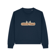 navy christmas sweater with the slogan 'christmas' and antlers poking out of the top