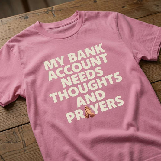 Pink My Bank Account Needs Thoughts and Prayers t-shirt on wood, funny relatable slogan ladies tee