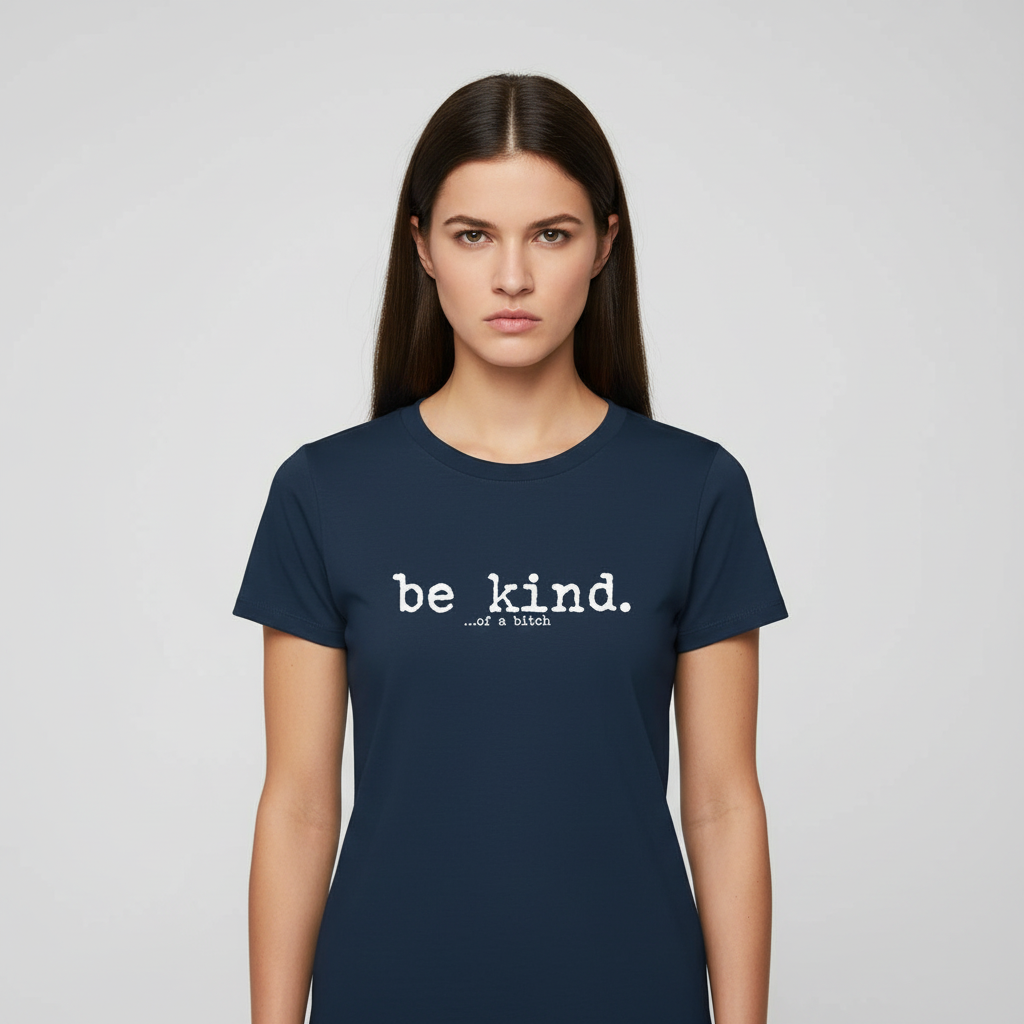Woman wearing a navy blue t-shirt with 'be kind' text on a light gray background