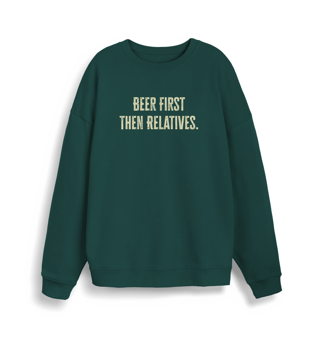 green christmas slogan sweater with 'beer first then relatives'