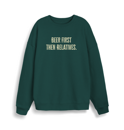 green christmas slogan sweater with 'beer first then relatives'