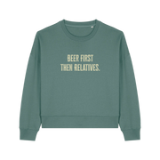 green christmas sweater with the slogan 'beer first then relatives'