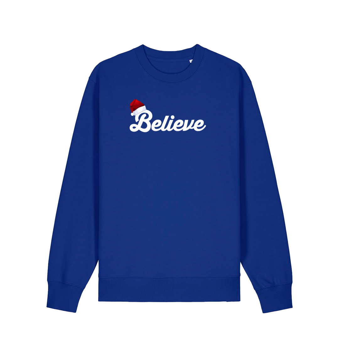 blue christmas sweate with the slogan 'believe' and a santa hat on top of the b