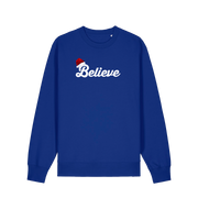 blue christmas sweate with the slogan 'believe' and a santa hat on top of the b