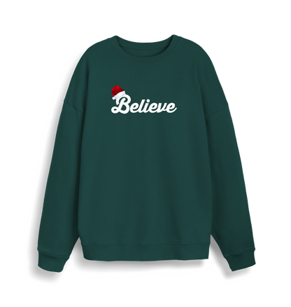 green christmas sweate with the slogan 'believe' and a santa hat on top of the b