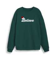 green christmas sweate with the slogan 'believe' and a santa hat on top of the b
