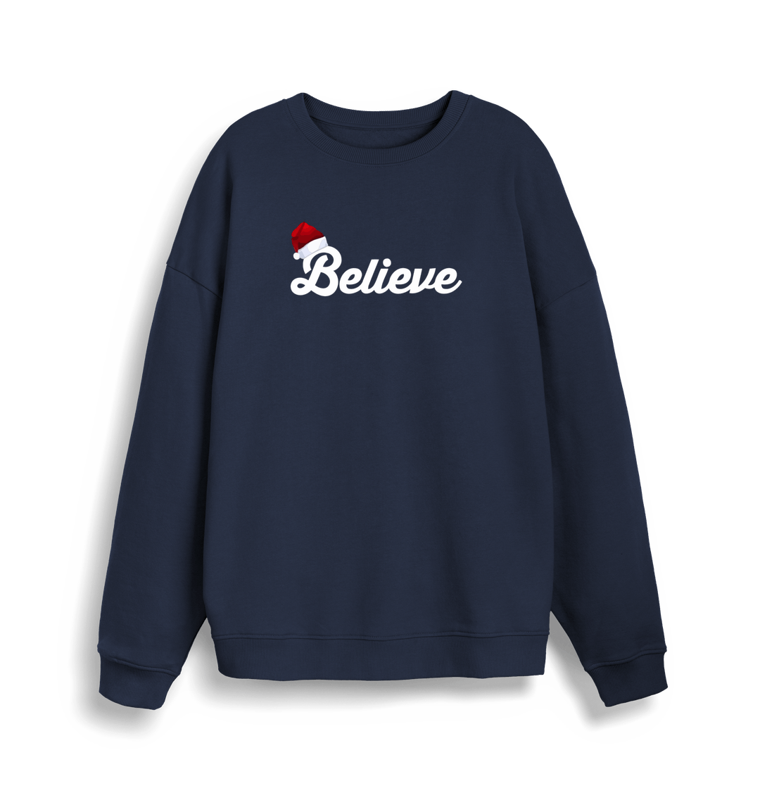 navy christmas sweate with the slogan 'believe' and a santa hat on top of the b