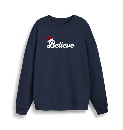 navy christmas sweate with the slogan 'believe' and a santa hat on top of the b