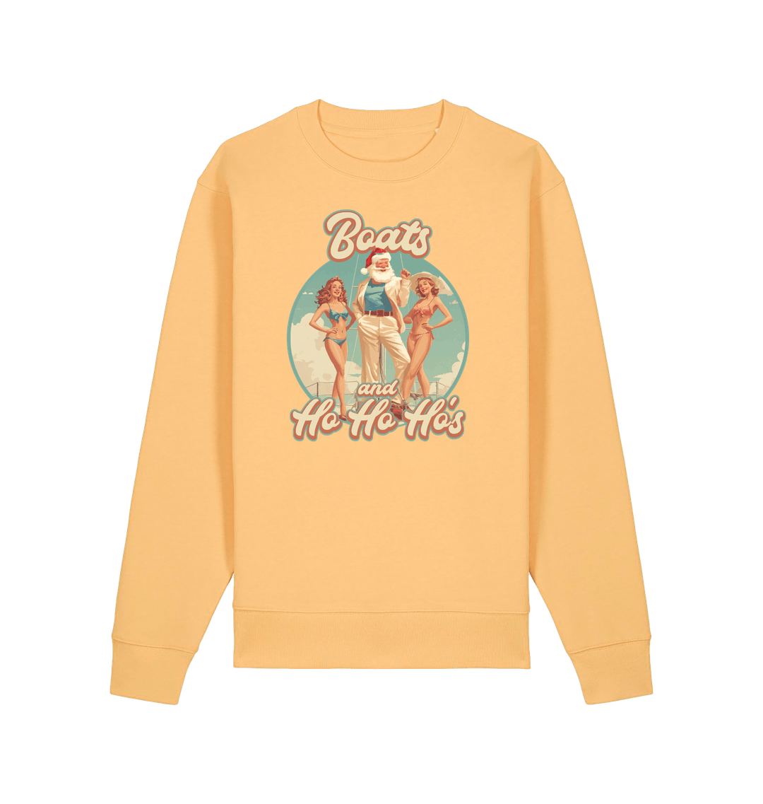 yellow christmas sweater with the graphic of santa stood between two women and the slogan 'boats and ho ho ho's'