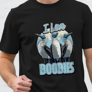 Black t-shirt with a funny graphic of three birds and 'I Love Boobies' slogan on a plain background