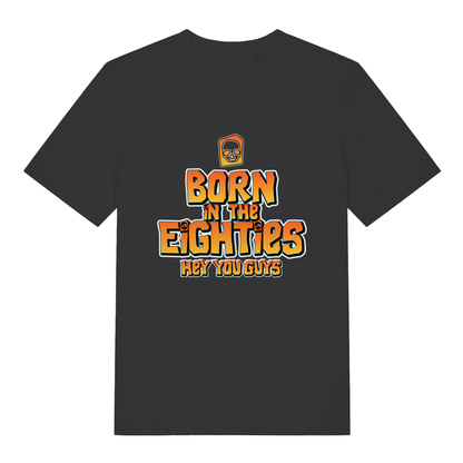 Black Born in the Eighties T-shirt flat lay with Goonies-style "Born in the Eighties Hey You Guys" graphic perfect 80s nostalgia tee