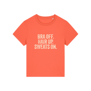 orange slogan t-shirt with 'bra off hair up sweats on'