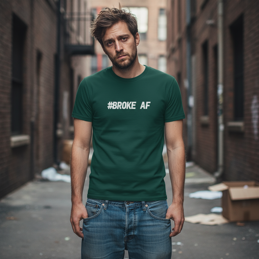 Man wearing a green t-shirt with '#BROKE AF' text in an urban alley.