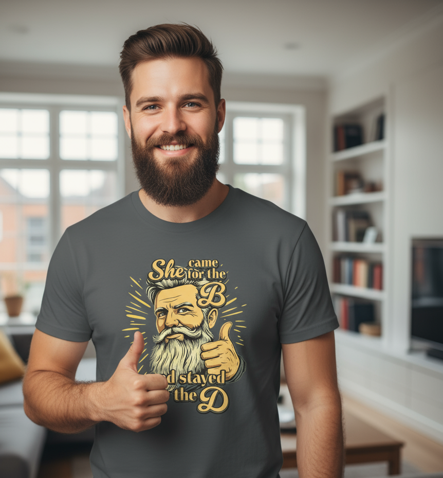 Man wearing a t-shirt with a graphic design in a living room setting