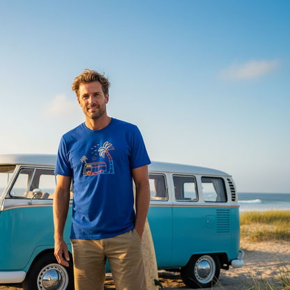 Man standing in front of a blue and white vintage van on a beach.