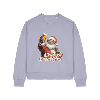 lavender christmas sweater with a graphic of santa raising a pint and the slogan 'cheers fuckers'