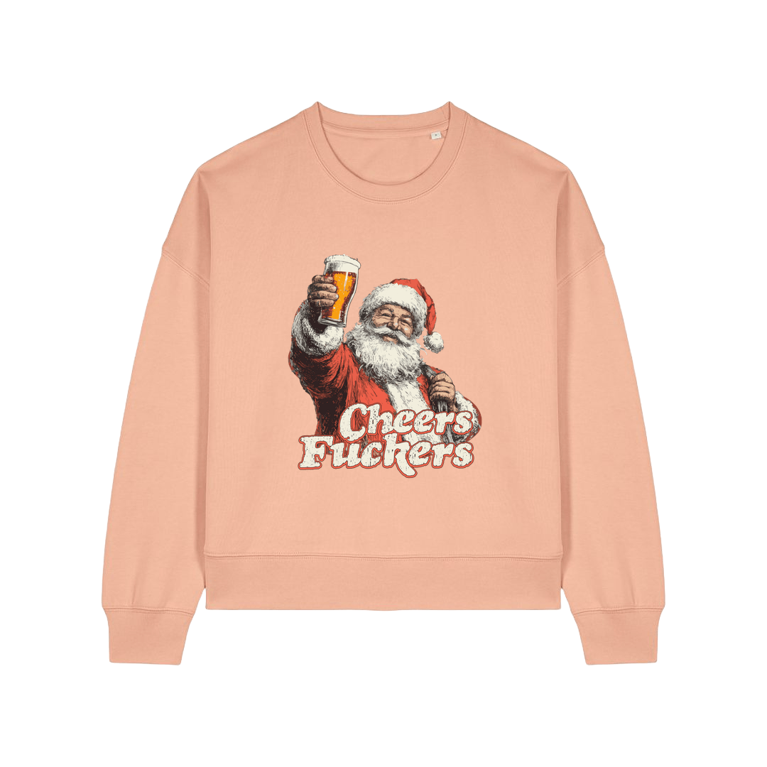 peach christmas sweater with a graphic of santa raising a pint and the slogan 'cheers fuckers'