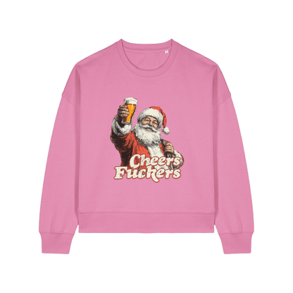 pink christmas sweater with a graphic of santa raising a pint and the slogan 'cheers fuckers'