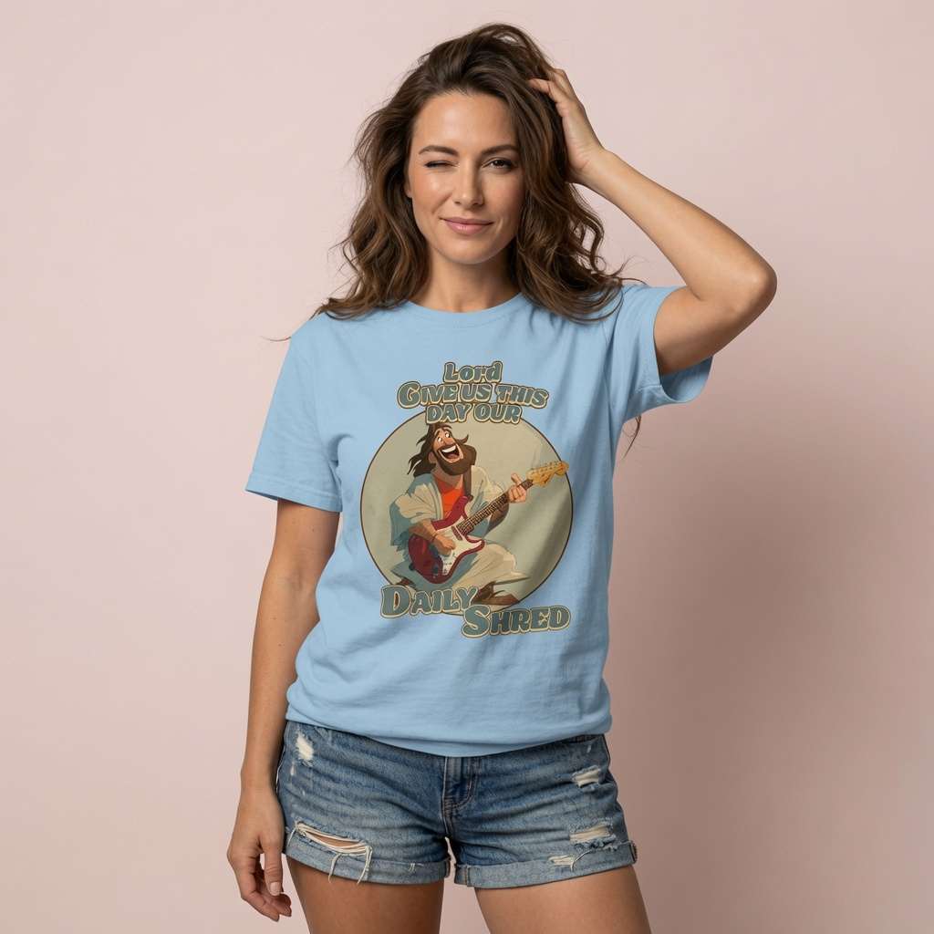 Woman in light blue Daily Shred t-shirt, funny jesus joke pun graphic tee