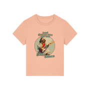 peach funny jesus t-shirt with the graphic of jesus playing a guitar and the slogan 'lord give us this day our daily shred'