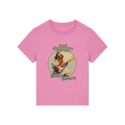 pink funny jesus t-shirt with the graphic of jesus playing a guitar and the slogan 'lord give us this day our daily shred'